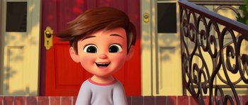 Movie still from “The Boss Baby” (2017), directed by Tom McGrath – A cartoon of a little boy smiling for the camera; Medium shot, Low angle