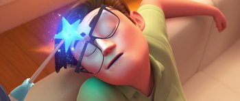 Movie still from “The Boss Baby” (2017), directed by Tom McGrath – A boy with glasses is laying on the ground; Close Up shot, Overhead angle