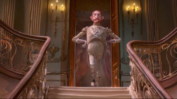 Movie still from “The Boxtrolls” (2014), directed by Anthony Stacchi – A statue of a man in a suit on the stairs; Wide shot, Low angle