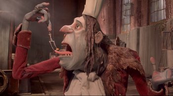 Movie still from “The Boxtrolls” (2014), directed by Anthony Stacchi – An image of an animated character eating food; Close Up shot, Low angle