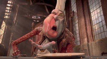 Movie still from “The Boxtrolls” (2014), directed by Anthony Stacchi – A person with a big head is eating food; Extreme Close Up shot, Low angle