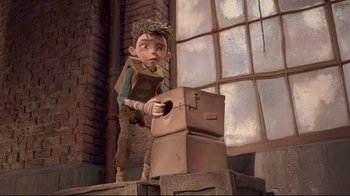 Movie still from “The Boxtrolls” (2014), directed by Anthony Stacchi – A boy is standing next to a stack of cardboard boxes; Wide shot, Low angle