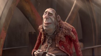 Movie still from “The Boxtrolls” (2014), directed by Anthony Stacchi – A character from the animated movie where a troll is smiling; Medium shot, Low angle