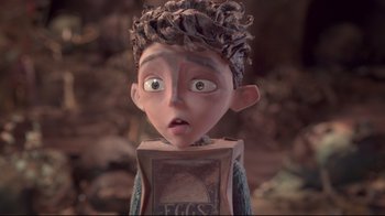 Movie still from “The Boxtrolls” (2014), directed by Anthony Stacchi – A cartoon of a boy with a box on his head; Close Up shot, Over the shoulder angle