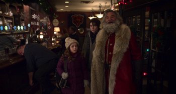 Movie still from “The Christmas Chronicles” (2018), directed by Clay Kaytis – A group of people dressed up as santa claus; Medium shot, Over the shoulder angle