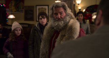 Movie still from “The Christmas Chronicles” (2018), directed by Clay Kaytis – A man with a long beard and a fur coat; Close Up shot, Over the shoulder angle
