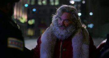 Movie still from “The Christmas Chronicles” (2018), directed by Clay Kaytis – A man with a beard and a long white beard; Close Up shot, Over the shoulder angle