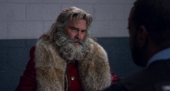 Movie still from “The Christmas Chronicles” (2018), directed by Clay Kaytis – An old man with a long beard wearing a fur coat; Close Up shot, Over the shoulder angle
