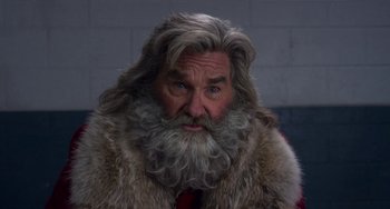 Movie still from “The Christmas Chronicles” (2018), directed by Clay Kaytis – An old man with a beard and a long beard; Close Up shot, Low angle