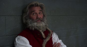 Movie still from “The Christmas Chronicles” (2018), directed by Clay Kaytis – An old man with long grey hair and a long beard; Close Up shot, Over the shoulder angle