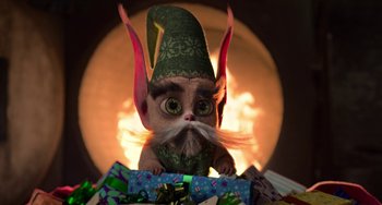 Movie still from “The Christmas Chronicles” (2018), directed by Clay Kaytis – A stuffed animal elf sitting on top of a pile of presents; Close Up shot, High angle