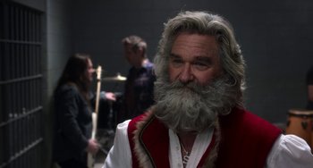 Movie still from “The Christmas Chronicles” (2018), directed by Clay Kaytis – An older man with long gray hair and a beard; Close Up shot, Over the shoulder angle