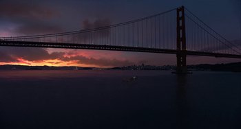 Movie still from “The Christmas Chronicles” (2018), directed by Clay Kaytis – A view of the golden gate bridge at sunset; Extreme Wide shot, High angle