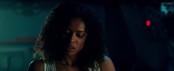 Movie still from “The Cloverfield Paradox” (2018), directed by Julius Onah – A person with curly black hair; Close Up shot, Low angle