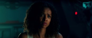 Movie still from “The Cloverfield Paradox” (2018), directed by Julius Onah – A person with curly black hair; Close Up shot, Low angle