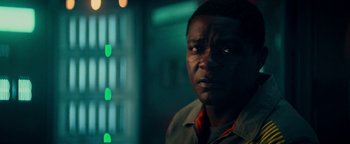 Movie still from “The Cloverfield Paradox” (2018), directed by Julius Onah – A person in a dark room; Close Up shot, Low angle
