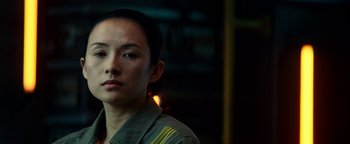 Movie still from “The Cloverfield Paradox” (2018), directed by Julius Onah – A person wearing a uniform; Close Up shot, Over the shoulder angle