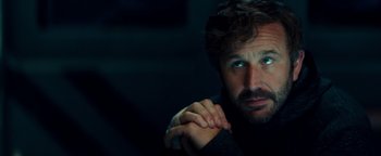 Movie still from “The Cloverfield Paradox” (2018), directed by Julius Onah – A person wearing a black sweater; Close Up shot, Over the shoulder angle