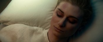 Movie still from “The Cloverfield Paradox” (2018), directed by Julius Onah – A person laying in a bed; Close Up shot, Overhead angle