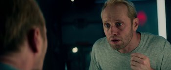 Movie still from “The Cloverfield Paradox” (2018), directed by Julius Onah – A person looking at the camera; Close Up shot, Over the shoulder angle