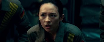 Movie still from “The Cloverfield Paradox” (2018), directed by Julius Onah – A person wearing a jacket; Close Up shot, Over the shoulder angle