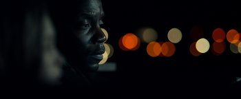 Movie still from “The Cloverfield Paradox” (2018), directed by Julius Onah – A black man is looking into the distance; Close Up shot, Low angle