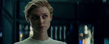 Movie still from “The Cloverfield Paradox” (2018), directed by Julius Onah – A person with short blonde hair; Close Up shot, Over the shoulder angle