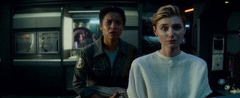 Movie still from “The Cloverfield Paradox” (2018), directed by Julius Onah – Two people standing next to each other in a room; Medium shot, Over the shoulder angle