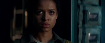 Movie still from “The Cloverfield Paradox” (2018), directed by Julius Onah – A person looking at the camera; Close Up shot, Low angle