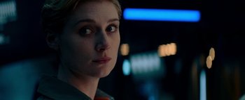 Movie still from “The Cloverfield Paradox” (2018), directed by Julius Onah – A person looking at the camera; Close Up shot, Over the shoulder angle