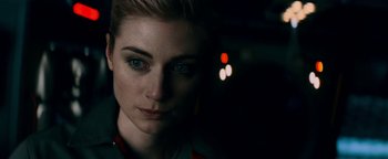 Movie still from “The Cloverfield Paradox” (2018), directed by Julius Onah – A woman's face in the dark; Close Up shot, Over the shoulder angle