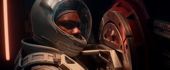 Movie still from “The Cloverfield Paradox” (2018), directed by Julius Onah – A man in a space suit looking into a mirror; Close Up shot, Overhead angle