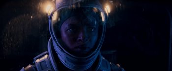 Movie still from “The Cloverfield Paradox” (2018), directed by Julius Onah – A man in a space suit is looking into the camera; Close Up shot, Over the shoulder angle