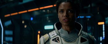 Movie still from “The Cloverfield Paradox” (2018), directed by Julius Onah – A woman in a space suit; Close Up shot, Over the shoulder angle