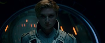 Movie still from “The Cloverfield Paradox” (2018), directed by Julius Onah – A woman with blonde hair wearing a space suit; Close Up shot, Low angle