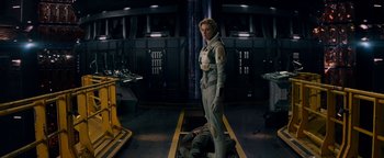 Movie still from “The Cloverfield Paradox” (2018), directed by Julius Onah – A man in a space suit standing next to another man in a space suit; Wide shot, High angle