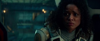 Movie still from “The Cloverfield Paradox” (2018), directed by Julius Onah – A person holding a camera; Close Up shot, Over the shoulder angle