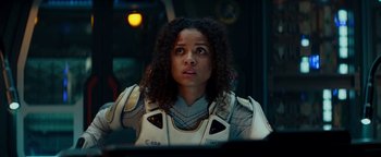 Movie still from “The Cloverfield Paradox” (2018), directed by Julius Onah – A woman in a space suit; Close Up shot, Over the shoulder angle