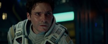Movie still from “The Cloverfield Paradox” (2018), directed by Julius Onah – A person wearing a helmet; Close Up shot, Over the shoulder angle