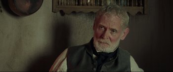 Movie still from “Mr. Turner” (2014), directed by Mike Leigh – An older man with a beard and a vest; Close Up shot, Over the shoulder angle