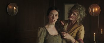Movie still from “Mr. Turner” (2014), directed by Mike Leigh – A woman is getting her hair combed by another woman; Close Up shot, Over the shoulder angle