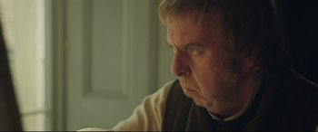 Movie still from “Mr. Turner” (2014), directed by Mike Leigh – An older man sitting in front of a window; Close Up shot, Over the shoulder angle
