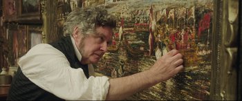 Movie still from “Mr. Turner” (2014), directed by Mike Leigh – An older man holding his hand out to a painting; Close Up shot, Over the shoulder angle