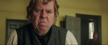 Movie still from “Mr. Turner” (2014), directed by Mike Leigh – An older man wearing a black vest and a white shirt; Close Up shot, Low angle