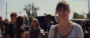Movie still from “Mud” (2012), directed by Jeff Nichols – A group of people standing next to each other on the street; Close Up shot, Over the shoulder angle