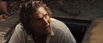 Movie still from “Mud” (2012), directed by Jeff Nichols – A person wearing a white shirt; Close Up shot, High angle