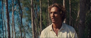 Movie still from “Mud” (2012), directed by Jeff Nichols – Matthew mcconaughey wearing a white shirt; Close Up shot, Over the shoulder angle