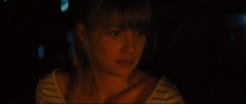 Movie still from “Mud” (2012), directed by Jeff Nichols – A person wearing a yellow and white striped shirt; Close Up shot, Over the shoulder angle