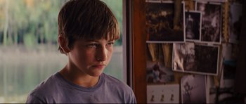 Movie still from “Mud” (2012), directed by Jeff Nichols – A young boy is looking into the distance; Close Up shot, Over the shoulder angle