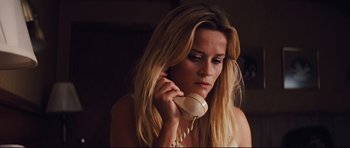 Movie still from “Mud” (2012), directed by Jeff Nichols – A woman holding a phone up to her ear; Close Up shot, High angle